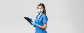 科维德防止病毒健康医疗保健工人检疫概念震惊了吓了一跳女护士医生蓝色的实习医生风云医疗面具持有剪贴板站在惊讶相机