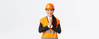 微笑感激的亚洲女架构师appreacite客户信仰持有<strong>手辩</strong>护感谢穿安全头盔夹克站白色背景