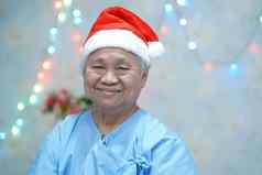 亚洲高级上了年纪的夫人女人病人圣诞老人老人助手他快乐圣诞节一年庆祝活动节日假期聚会，派对医院