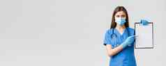 科维德防止病毒健康医疗保健工人检疫概念严肃的表情女护士医生蓝色的实习医生风云开药物治疗指出纸剪贴板