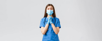 科维德防止病毒健康医疗保健工人检疫概念充满希望的女护士医生蓝色的实习医生风云医疗面具祈祷生活病人生病的冠状病毒感染