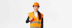支持很高兴快乐亚洲女首席工程师安全头盔显示竖起大拇指批准满意建设工作工业女人reflecive夹克检查区域