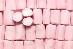 粉红色的白色迷你棉花糖占领整个图像