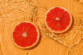 纹理夏天柑橘类红色的生新鲜的葡萄<strong>柚</strong>新鲜的水波