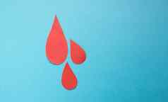 概念世界血捐赠血友病一天红色的纸滴血蓝色的背景的地方文本