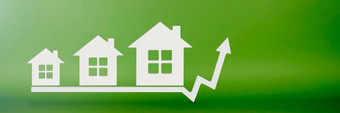 真正的房地产成本选择房子房子<strong>模型</strong>绿色背景概念保险购买真正的房地产信贷选择房子租公寓图<strong>箭头</strong>