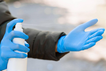 喷涂防腐剂手蓝色的医疗手套生活列病冠状病毒科维德