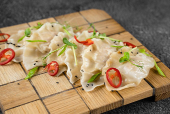 饺子中国人饺子命名饺子木板亚洲传统的快食物面团菜塞肉蔬菜肉