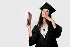学生书毕业袍帽准备好了完成大学未来领袖科学院士年轻的女人黑色的礼服微笑