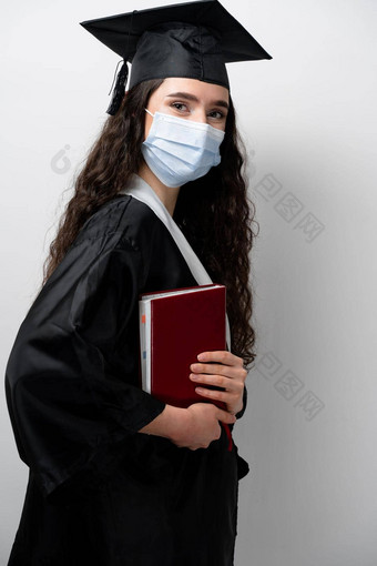 学生书毕业袍帽医疗面具冠状病毒科维德期未来领袖科学<strong>院士</strong>年轻的女人黑色的礼服微笑