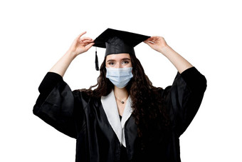 惊讶本科女孩医疗面具冠状病毒科维德期主毕业袍帽白色背景距离学习在线研究首页毕业大学