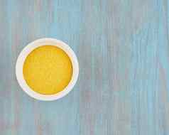 黄色的玉米面粉白色碗蓝色的木表格成分玉米粥谷蛋白免费的福德地图