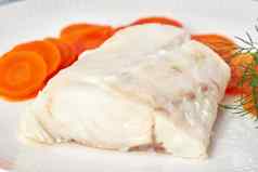 煮熟的鳕鱼胡萝卜莳萝白色板福德地图破折号穿越饮食一边视图特写镜头