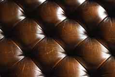 深丰富的真正的皮革纹理古董黑暗棕色（的）沙发按钮背景装饰设计奢侈品时尚生活方式概念室内装潢人工真正的皮革铆钉