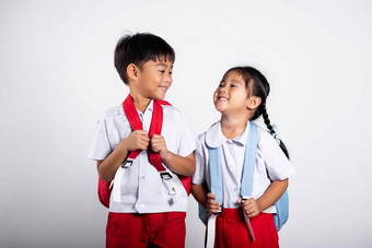 亚洲学生孩子女孩男孩小学生哥哥妹妹微笑快乐穿学生泰国统一的红色的裤子裙子