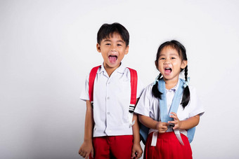 亚洲学生孩子女孩男孩小学生哥哥妹妹微笑快乐穿学生泰国统一的红色的裤子裙子图片