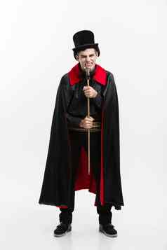 吸血鬼万圣节概念完整的长度肖像英俊的高加索人吸血鬼黑色的红色的万圣节服装