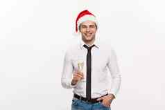 圣诞节概念英俊的业务男人。庆祝快乐圣诞节快乐一年穿圣诞老人他玻璃champange