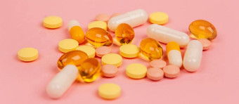 各种各样的制药医学药片平板电脑胶囊粉红色的背景药店主题五彩缤纷的药片抗生素药物治疗药片