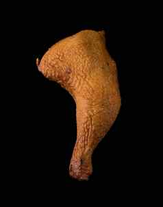 开胃的烟熏鸡腿冰黑色的背景隔离家禽肉鸡烟熏肉