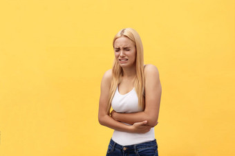 女人胃疼痛<strong>胃炎</strong>月经标志胃麻烦黄色的背景语气