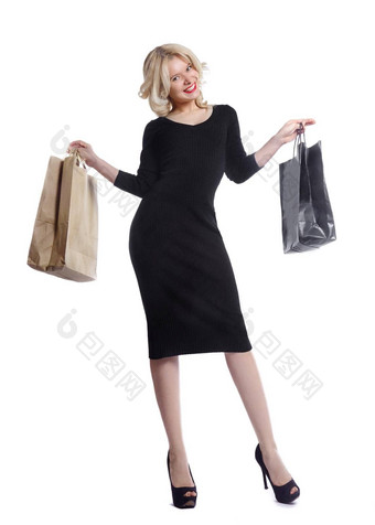 购物年轻的女人持有袋孤立的白色工作室背景爱时尚销售快乐金发碧眼的女孩黑色的奢侈品glomour衣服购物者手袋礼物
