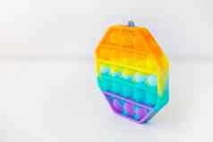 时尚感觉玩具受欢迎的色彩斑斓的六角形状的流行反压力玩具烦躁不安的人玩具彩虹流行的地方文本一边视图