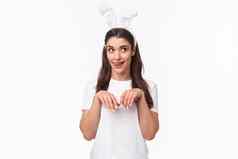 有趣的愚蠢的好玩的女孩兔子耳朵t恤舔嘴唇做白日梦美味的复活节一天模仿兔子手拉关闭胸部爪子