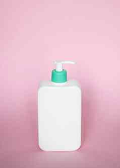 大白色塑料瓶泵自动售货机液体容器过来这里乳液奶油洗发水浴泡沫粉红色的背景