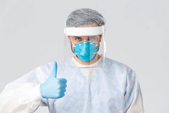 科维德流感大流行医疗保健工人战斗病毒爆发自信专业医生保护个人设备脸面具橡胶面具翘拇指战斗冠状病毒