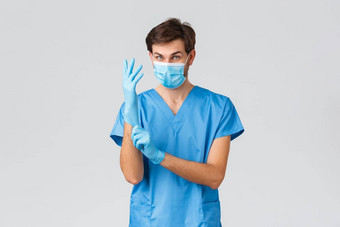 科维德检疫医院医疗保健工人概念热情的医生治疗病人诊所把个人保护设备外科医生手套医疗面具