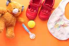 玩具新生儿婴儿集泰迪熊鞋橙色背景