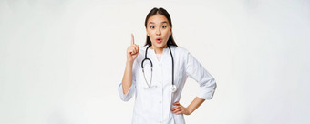 医疗保健医疗概念亚洲女人医生提高手指发现解决方案治疗病人指出热情的白色背景