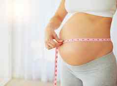跟踪怀孕里程碑常规的测量裁剪拍摄怀孕了女人测量肚子首页