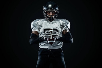 美国足球运动员球员头盔黑色的背景体育运动动机团队体育