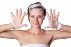 美丽的女人采取淋浴洗头头发洗头发洗发水