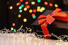圣诞节背景灯免费的文本空间圣诞节灯发光的色彩斑斓的圣诞节灯黑色的背景一年圣诞节装饰加兰