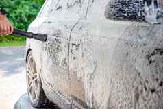 车洗过程洗车活跃的泡沫压力自助服务手册车洗车护理概念