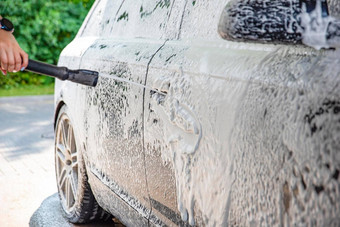 车洗过程洗车活跃的泡沫压力自助服务手册车洗车护理概念