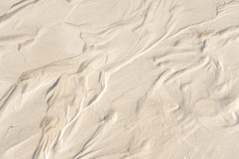 摘要白色<strong>沙子</strong>沉积物模式<strong>海边</strong>自然有机景观闪亮的太阳前视图概念上的变形图像潮湿的海<strong>沙子</strong>形成海海岸夏天假期