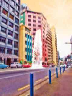 模糊色彩斑斓的城市街日落艺术概念城市小镇汽车停办公室建筑黄色的天空低角视图未来主义的摘要体系结构太阳耀斑