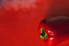 甜蜜的新鲜的红色的胡椒红色的背景光烟照片菜单适当的营养新鲜的蔬菜