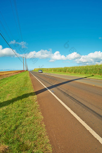 车辆距离骑开放高速<strong>公路</strong>路领先的农业农<strong>场景</strong>观日益增长的菠萝种植园场蓝色的天空云复制空间瓦胡岛夏威夷美国