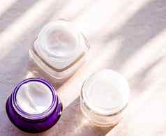保湿美奶油罐子护肤品水疗中心化妆品石头背景夏天日落化妆品产品皮肤护理
