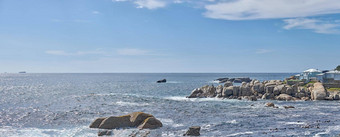 岩石海洋海岸阳光明媚的夏天一天蓝色的天空清晰的蓝色的水自然宁静平静海放松游泳海洋发现西方角南非洲