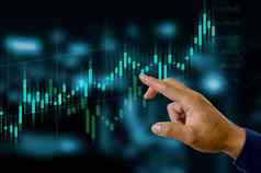 金融业务投资概念股票加密投资基金商人触碰虚拟屏幕数据烛台图表交易外汇图金融