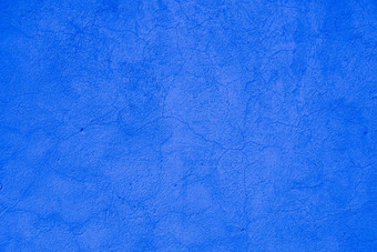 墙蓝色的粗糙的压花建筑装饰粉刷