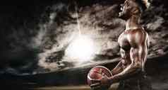 肖像美国黑人运动员篮球球员球适合年轻的男人。运动服装持有球