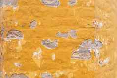 黄色的沙子破旧的破碎的墙背景纹理