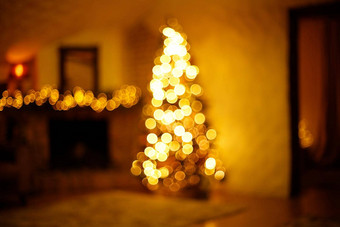 温暖的圣诞节首页房间圣诞节树节日散景照明模糊假期背景